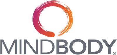 The mindbody logo prominently displayed in a boxing gym.